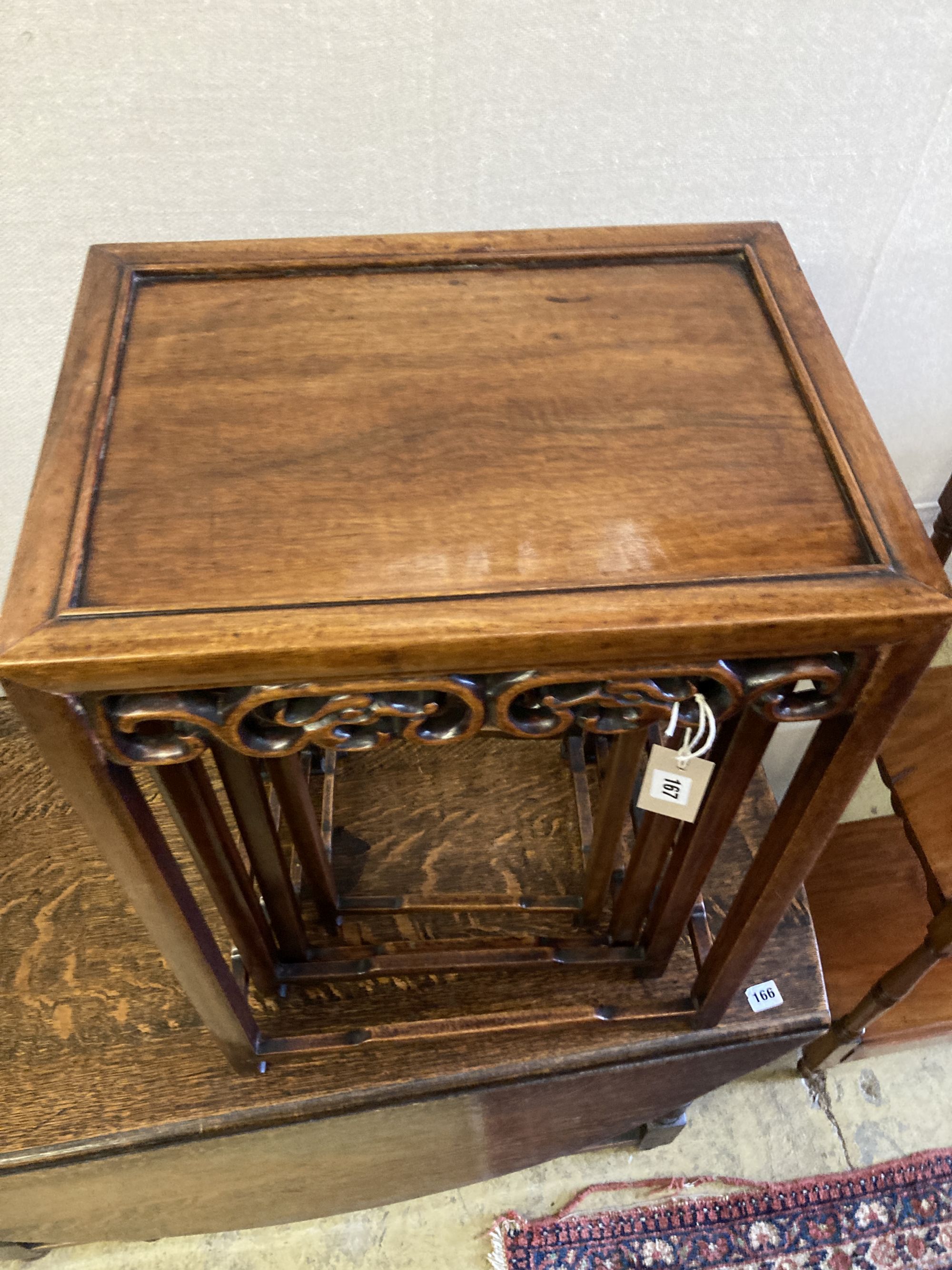 A nest of four Chinese carved hardwood tea tables, width 44cm, depth 33cm, height 62cm